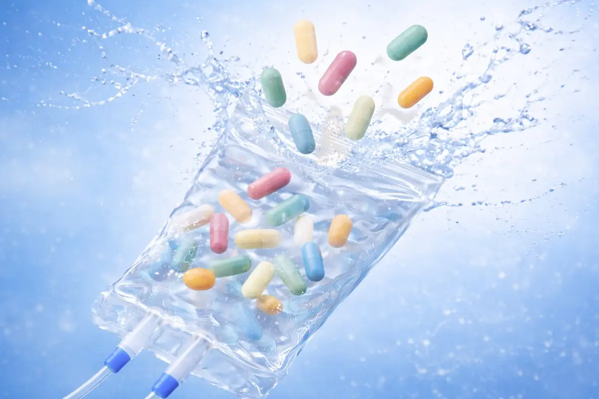 Mobile IV Therapy nurse administering NAD+ IV therapy to a client in Phoenix